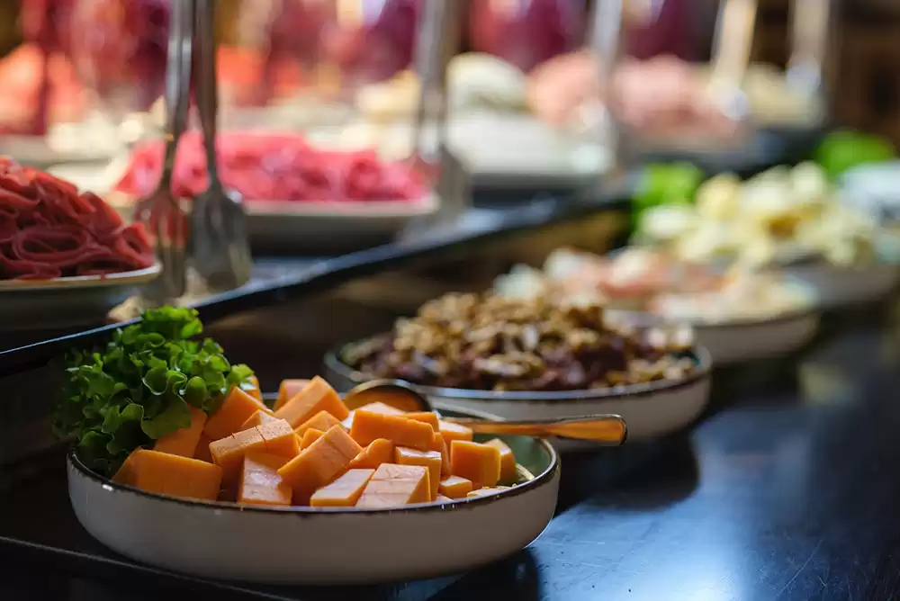 a buffet table full of food from a special catering company